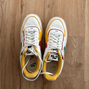 Nike Air Sneakers with Yellow and Red Accents